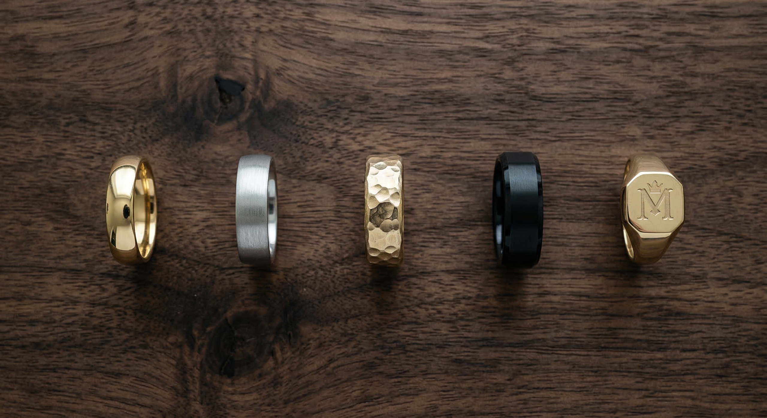 Different men's ring styles on display — polished, brushed, hammered, black and signet | Mens Rings Online